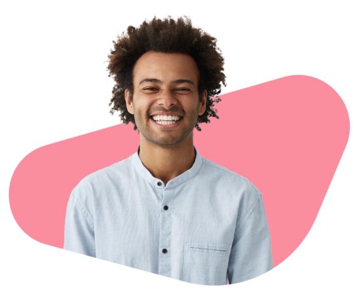 Man smiling in front of pink abstract shape